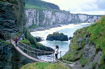This image shows people crossing the rope bridge at Carrick a Rede. 