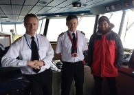 RNLI charity walker Alex Ellis-Roswell pictured on the Bridge of Ben-my-Chree with Captain John Pirrie (left) and Second Officer Laurence Campbell