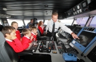 Captain John Pirrie explains how fast craft Manannan’s bridge operates and his role to pupils from Victoria Road Primary School during a tour of the Steam Packet Company vessel