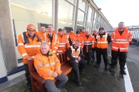 Colleagues of Isle of Man Steam Packet Company quayside worker Luc Raes with the bench installed at the Sea Terminal in his memory