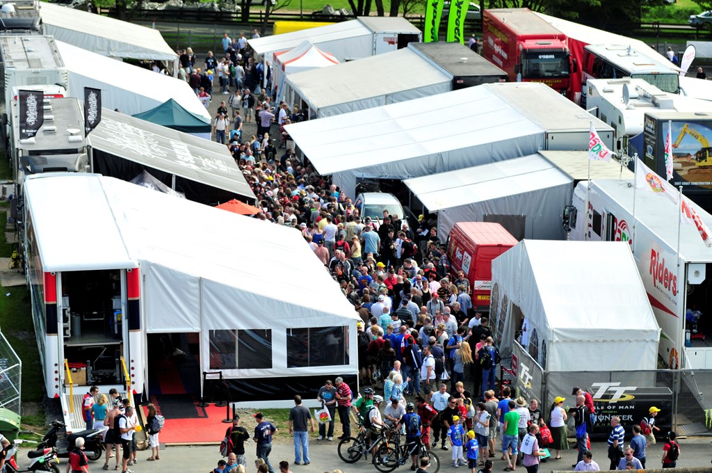 Image of the hustle and bustle at the Isle of Man TT Grandstand during TT  