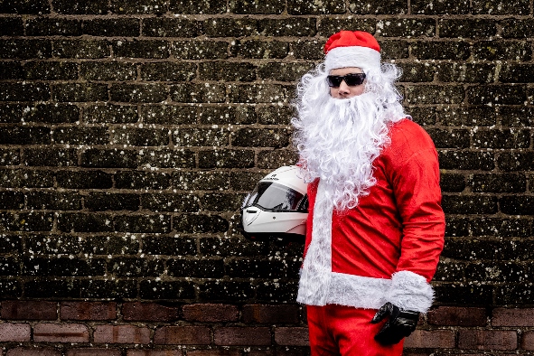 Oli Allen, Santa's on a Bike Event Organiser, dressed as Santa (photo credit - Plan.com)