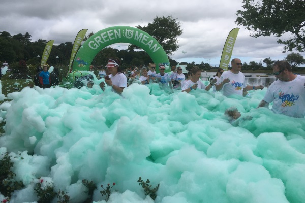 A sea of green bubbles at Hospice Bubble Rush.