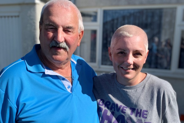 Beverley Cowan with her dad, Chucka O’Brien, after she 'Braved the Shave' in aid of Macmillan Cancer Support