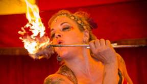 This is an image of a lady breathing fire at the circus at Milntown estate Isle of Man