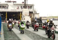Motorcycles disembarking from Manannan