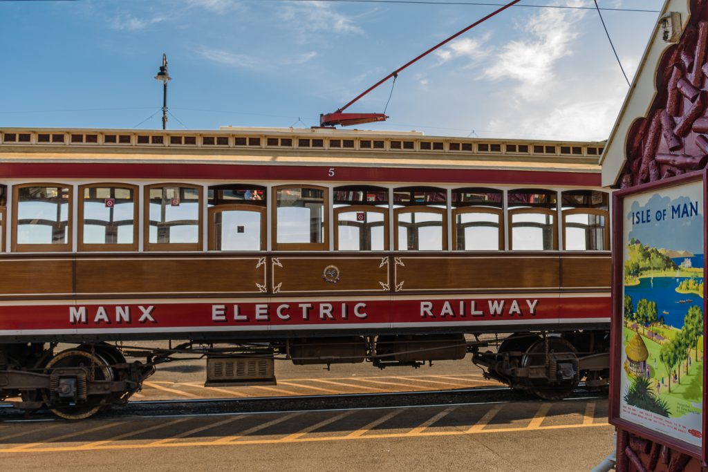 Manx Electric Railway Tram about to depart against a sunny blue sky 