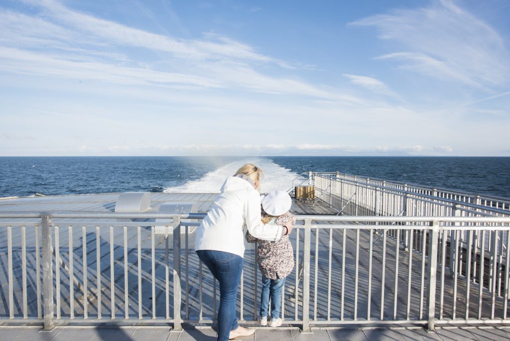 Mum and daughter taking in sea views on board a Steam Packet Company vessel 
