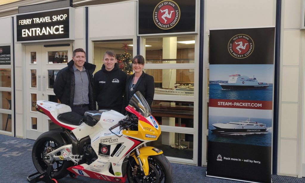 Isle of Man Steam Packet Company representatives with Nathan Harrison, motorcyclist alongside his motorbike.