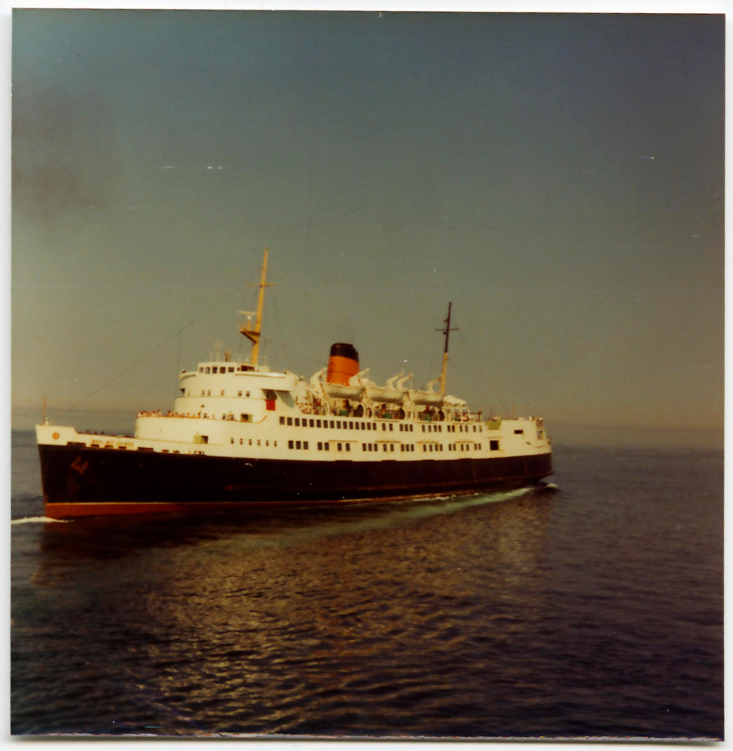 A colour photo of the fifth Steam Packet Company vessel to bear the name Ben-my-Chree in calm waters 