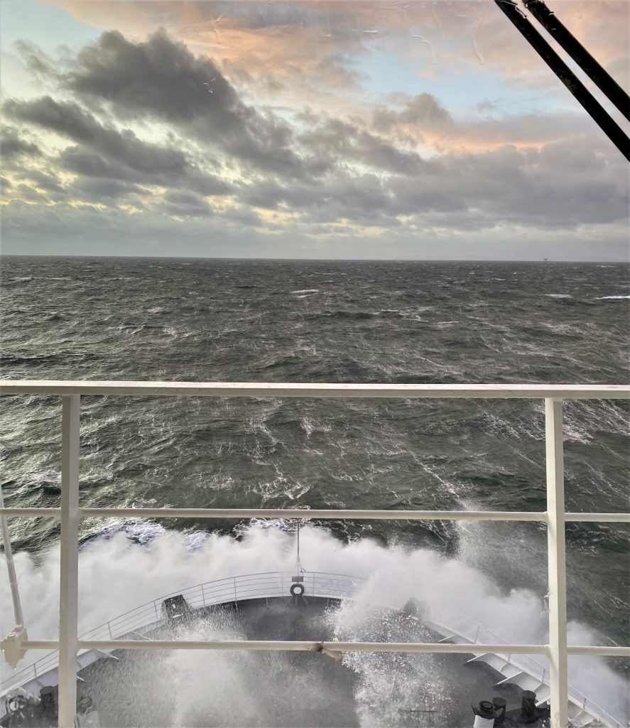 The view from the bridge of the Ben-my-Chree  - stormy seas with a cloudy pink sky 