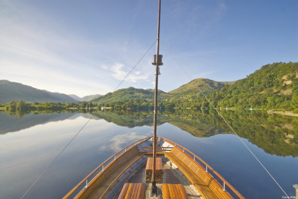 Ullswater Steamers, Lake District, Cumbria, England. Front of small boat visible with beautiful lake in view. 