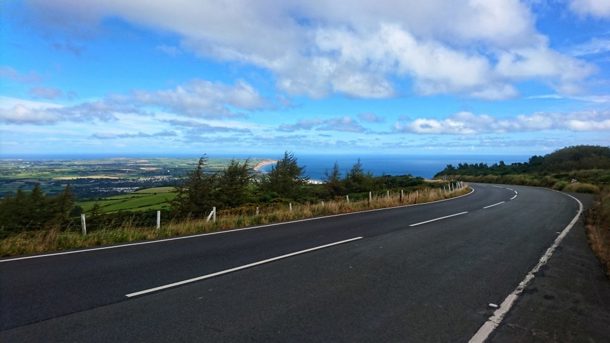 A stretch of road on the Mountain Road on a summers day with Ramsey in the distance