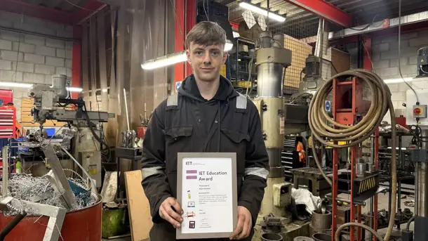 IOMSPC apprentice Ryan Christian in the workshop holding his award